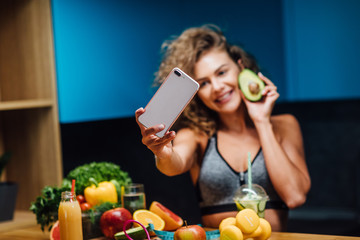Wall Mural - Healthy green eat, selfie girl taking picture or video vlog for social network of clean food diet for instagram stories.