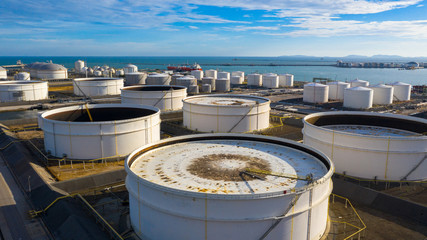 Aerial view of tank terminal with lots of oil storage tank and petrochemical storage tank in the harbour, Industrial tank storage aerial view.