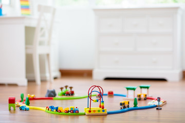 Kids room with wooden railway and train.