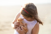 Little Girl Holding Baby Cat. Kids And Pets