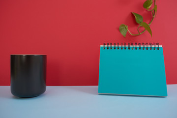  Colorful background with a notebook on top of a table and a notebook. Contemporary and youth design.