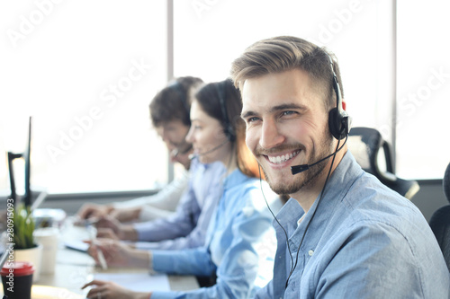 Cuadros en Lienzo Portrait of call center worker accompanied by his team
