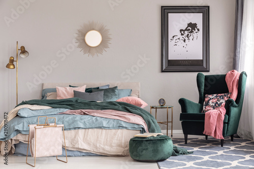 Emerald Green Armchair With Floral Pillow And Pastel Pink