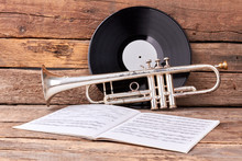 Trumpet And Musical Papers On Old Wood. Vintage Musical Equipment. Classics Music Concept.