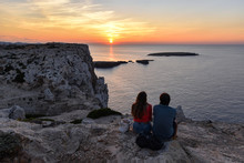 Young Couple Watching Sunset, Menorca (Spain)