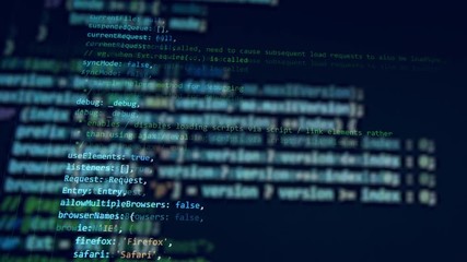 Wall Mural - a working computer with a code on a monitor.