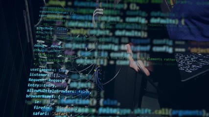 a person works with a laptop, programming a code.