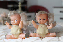 Hilarious Twin Dolls Looking Happy 