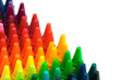 Box of crayons in a rainbow of colors with blank white space