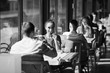 © davit85 - A young couple drinking wine in a restaurant near the window.