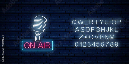 Fotomural Neon on the air sign with retro microphone with alphabet