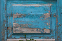 Background As Part Of An Old Wooden Door With Peeling Blue-gray Paint