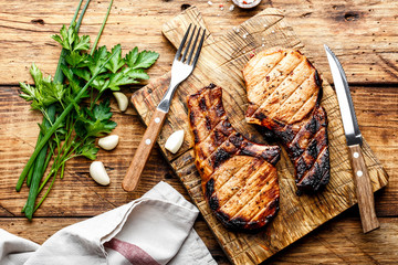 grilled meat, a portion of two pork loin steaks barbecue