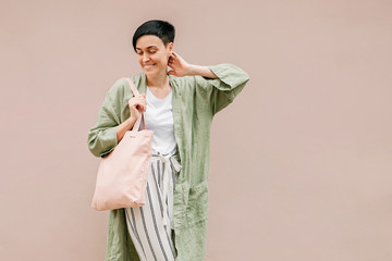 Wall Mural - Young woman with eco bag enjoying morning. Eco friendly concept. .