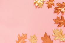 Autumn Composition With A Gold And Copper Spray Painted Natural Leaves On Pink Background. Flat Lay, Top View, Copy Space.