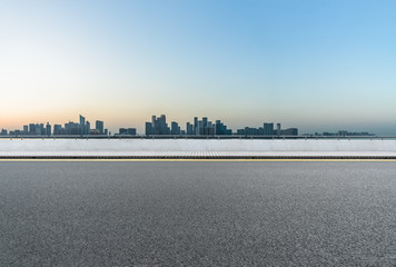 empty asphalt road with city skyline background in china.