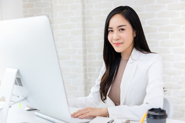 Smart Asian businesswoman working in office