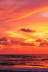 Wall Mural - Dramatic sunset sky over a tropical sea.