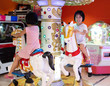 Leinwandbild Motiv Asian Little Chinese Sisters playing at amusement