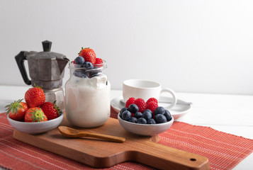 yogurt with fruit on a breakfast table