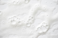 Abstract Background White Soapy Foam Texture. Shampoo Foam With Bubbles