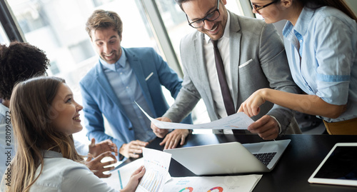 Zdjęcie: Group of successful business people at work in office Group of successful business people at work in office