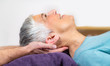 © Microgen - Physical Therapist Working with Neck. Senior Woman