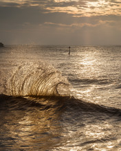 Waves Backlit By The Dawn Sun Reflect Off The Sea Wall And Impact With An Incoming One, Exmouth, Devon