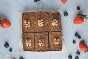 Vegan sweet potato brownie on white table. Healthy vegan food concept.