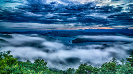 Wall Mural - sunset over lake jcassee from jumping off rock overlook