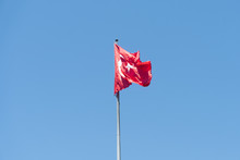 Turkish Flag Against A Blue Sky