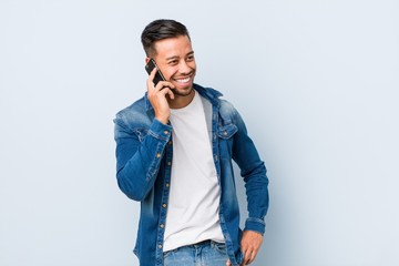 Young filipino man talking on phone