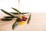 Fototapeta  - argan oil pouring over argan seeds