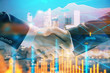 © Andrey - Double exposure of financial chart on cityscape background with two businessmen handshake. Concept of financial analysis and investment opportunities