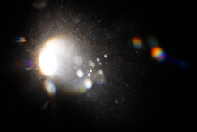Lens Flare. Light Over Black Background. Easy To Add Overlay Or Screen Filter Over Photos. Abstract Sun Burst With Digital Lens Flare Background. Gleams Rounded And Hexagonal Shapes, Rainbow Halo.