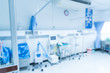 © arcyto - Blurry empty interior operating room and modern equipment in hospital.Medical device for surgeon surgical emergency patient in blue tone style.Save life medical treatment concept.