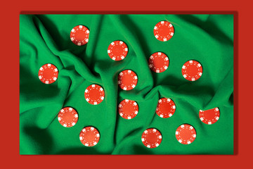 op view red poker chips on green cloth 