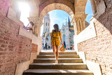 Fototapeta Natura - A young woman enjoying her trip to the Castle of Budapest