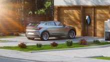 Electric Car Parked In Front Of Home Modern Low Energy Suburban House 3d Rendering