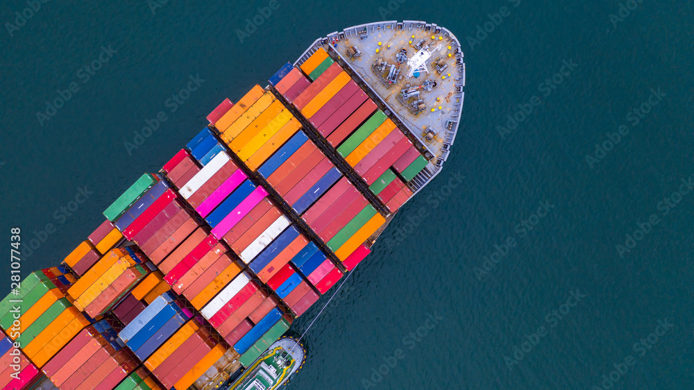 Container ship carrying container aerial view, Business import and export logistic and transportation of international by container ship in the open sea, with copy space. - obrazy, fototapety, plakaty 