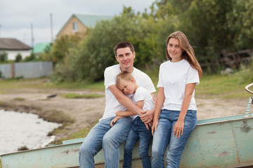 portrait of happy family. father with two children in countryside outdoors