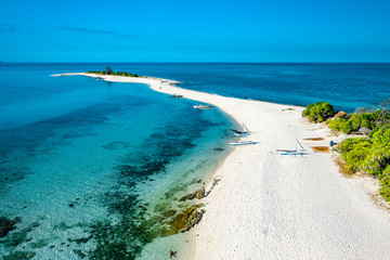 Truly amazing tropical island in the middle of the ocean. Aerial view of an island with white sand beaches and beautiful lagoons