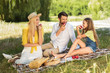 © Prostock-studio - Young family enjoying summer picnic in countryside