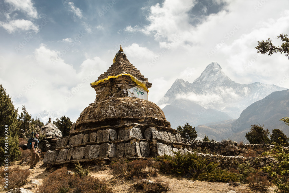 Hiker Looking Up at Buddhist Stupa Shrine Stock Photo | Adobe Stock