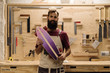 © Milles Studio/Stocksy - Craftsman with skateboard in shop