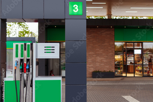 Cuadros en Lienzo Gas pump near store on filling station