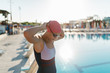 © Brat Co./Stocksy - Swimmer wearing goggles near swimming pool