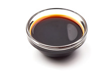 Tasty soy sauce in a bowl, isolated on white background