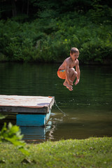 Childhood fun cannonball pond jumping