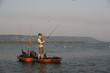 © Colin - Young Man Kayak Fishing at Sunrise in Canada